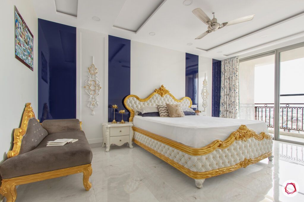 hiranandani bangalore-golden bed designs-blue and white wall accents