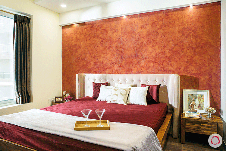 bedroom accent wall-orange wallpaper-textured wall-white headboard designs