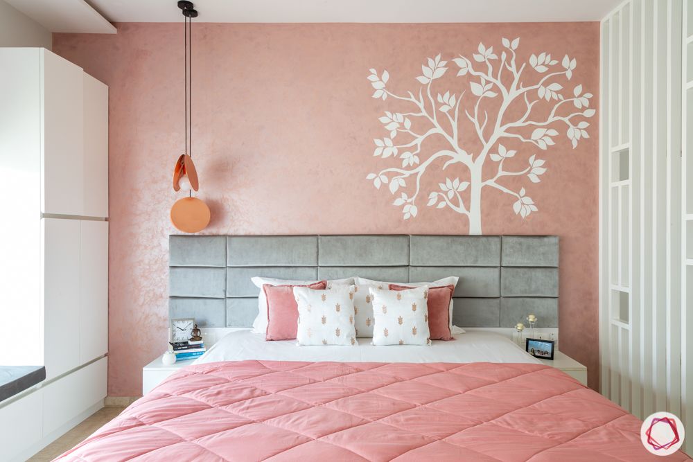 bedroom accent wall-pastel pink wall-mural painting-pendant light-grey headboard 