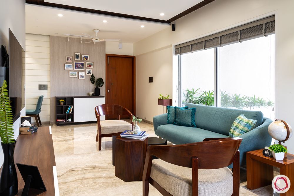 home renovation mumbai-terrace home-blue sofa designs-wooden elements-wooden chair