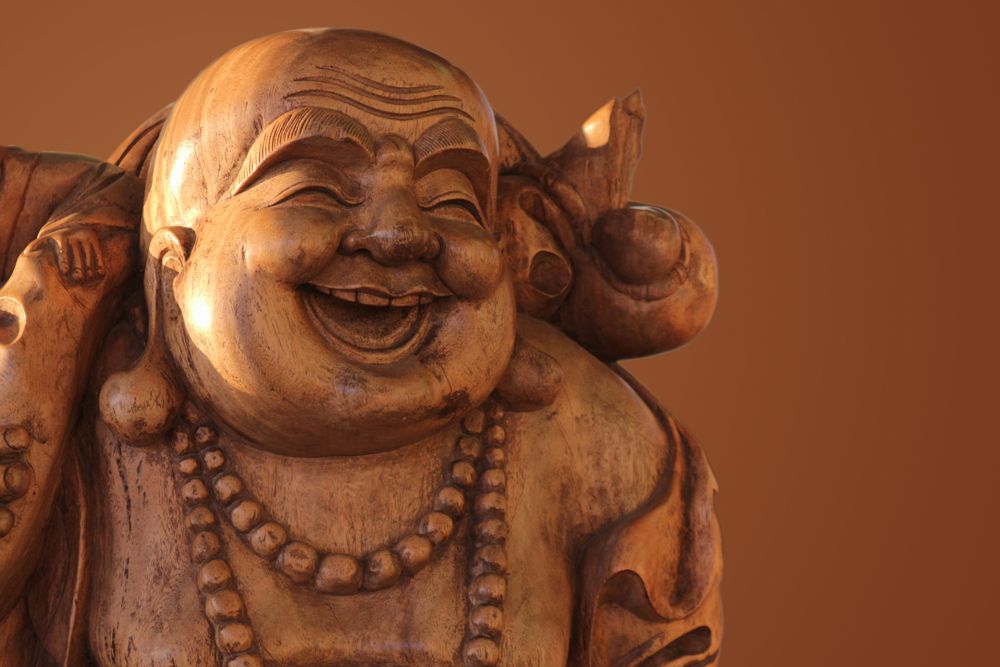 different types of laughing buddha statues