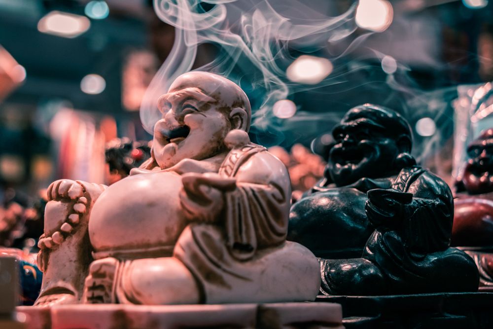 The laughing deals buddha meaning