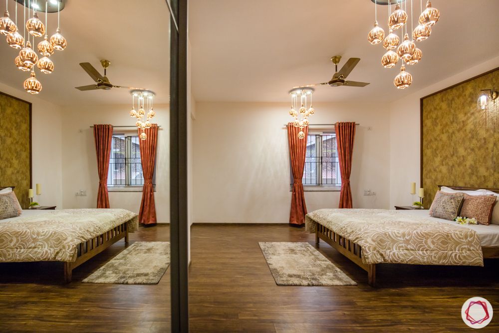 western hills baner-gold accent wall-wooden flooring-pendant lights-wooden bed-side table-mirror panel