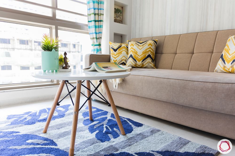 1-bhk-interior-design-living room-centre table-sofa-cum-bed