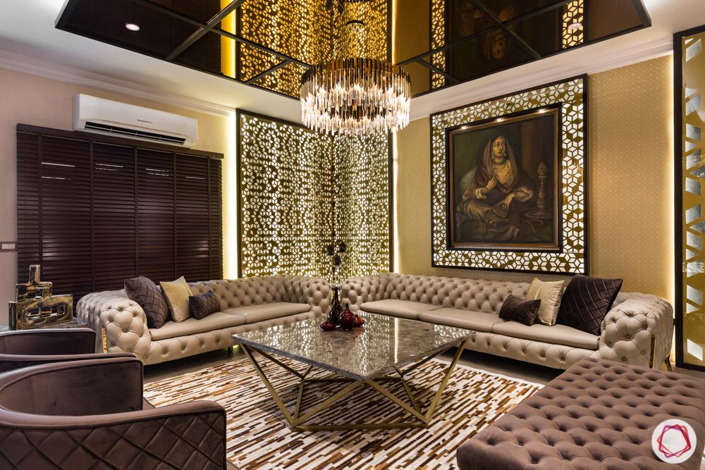 luxury-living-room-interiors-tufted-sofas-chandelier- coffee-table-bench