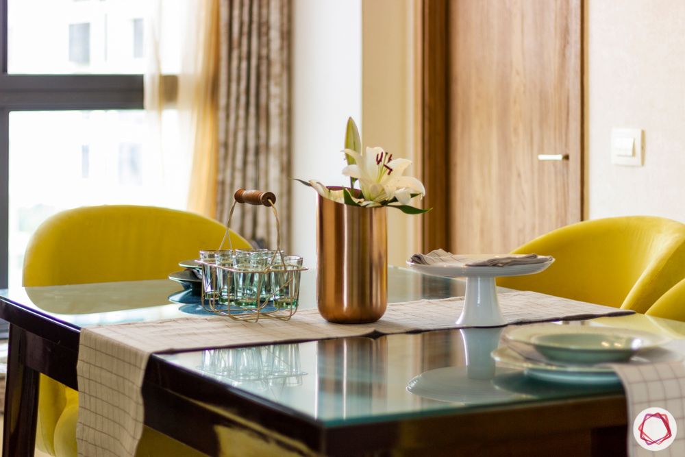 snn raj etternia-dining room-yellow chairs-wooden dining table-flower vase
