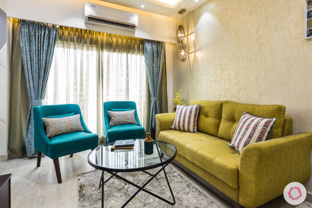 Panchsheel-Pratishtha-living-room-sofas-yellow-blue-coffee-table