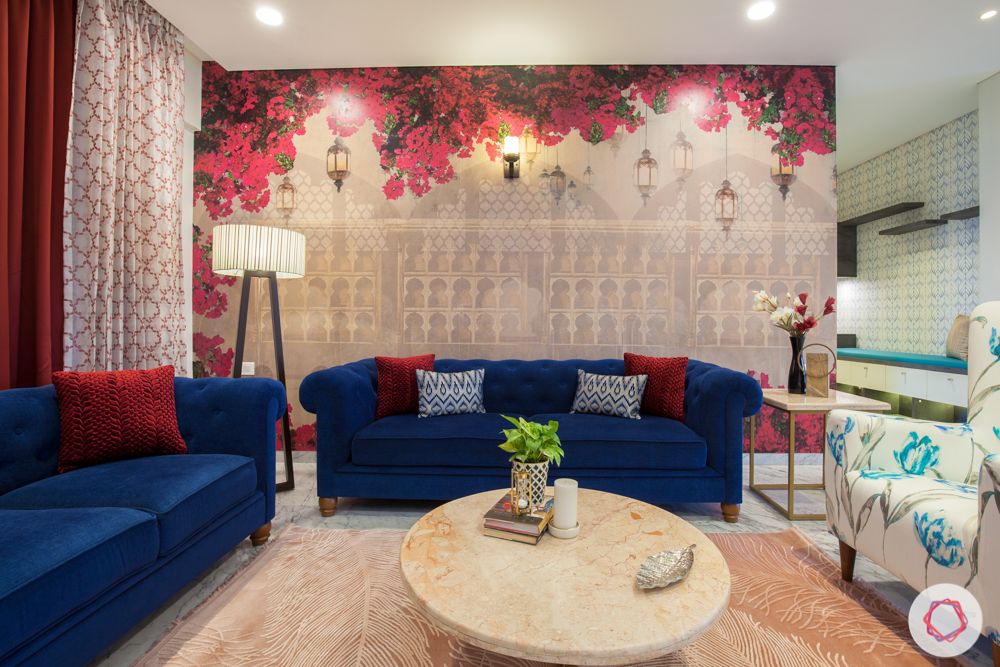 home in pune-bougainvillea wallpaper-floor lamp-blue sofa-marble center table