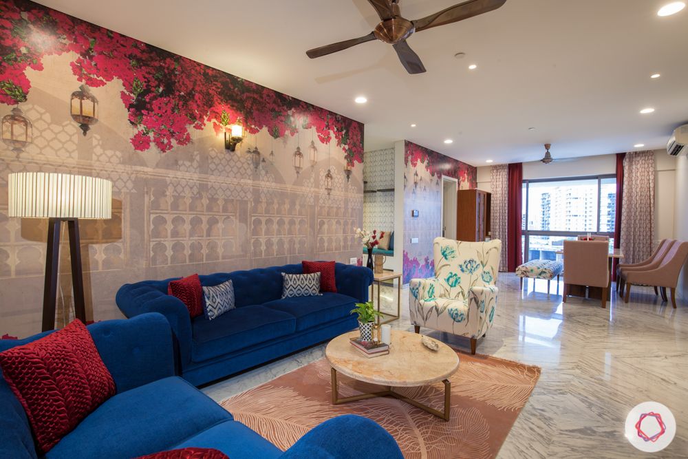 home in pune-bougainvillea wallpaper-floor lamp-blue sofa-marble center table