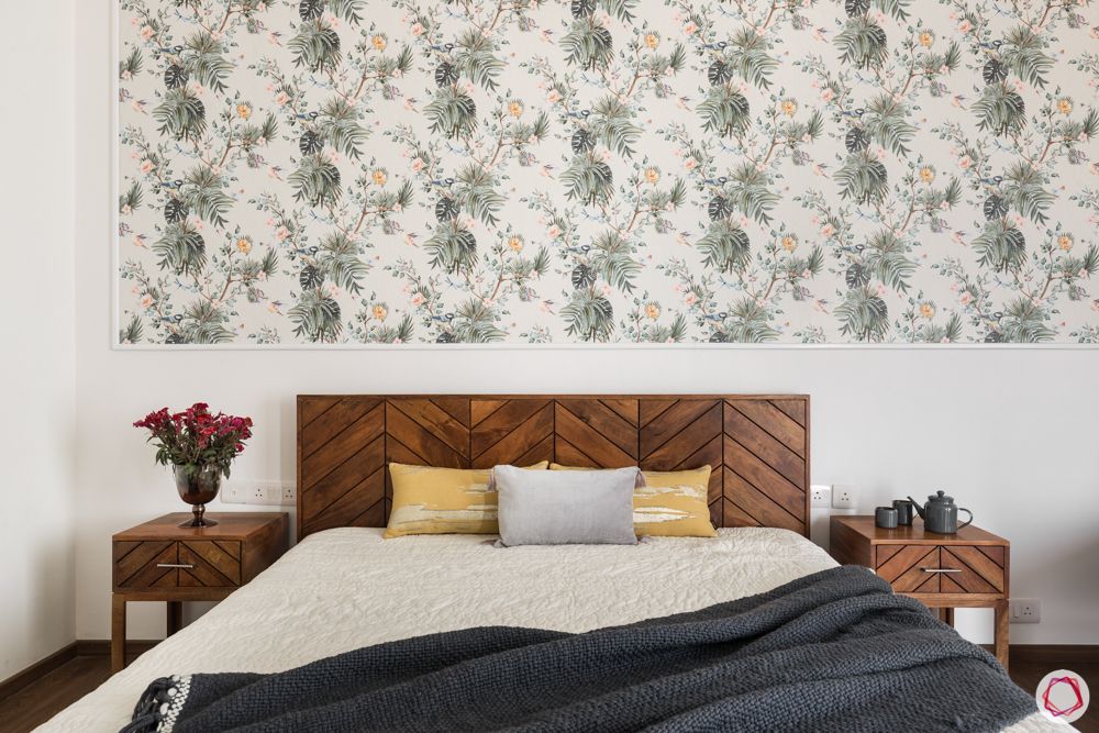 4 bhk apartment-wooden bed-floral wallpaper-white walls-wooden bedside table