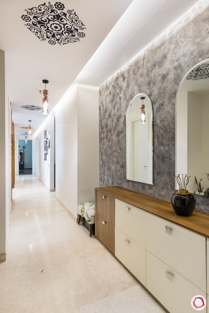 4 bhk apartment-living room-mirror foyer-ceiling motif-grey wall
