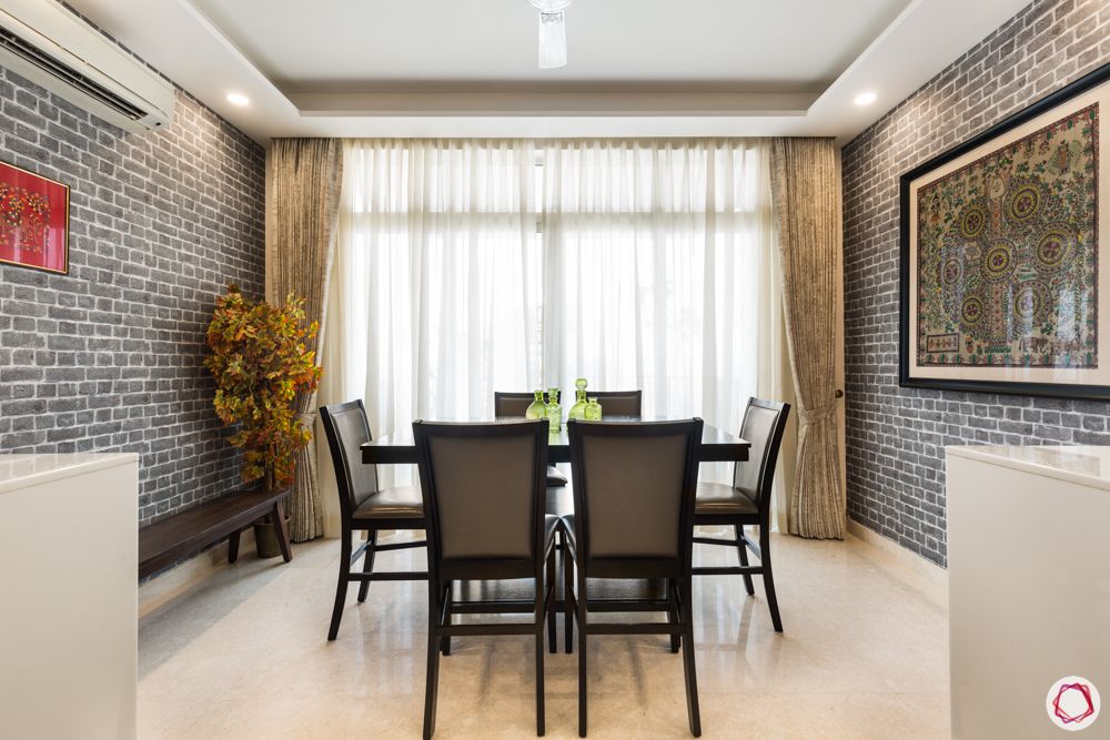 4 bhk apartment-dining table designs-window in dining room-grey brick wall