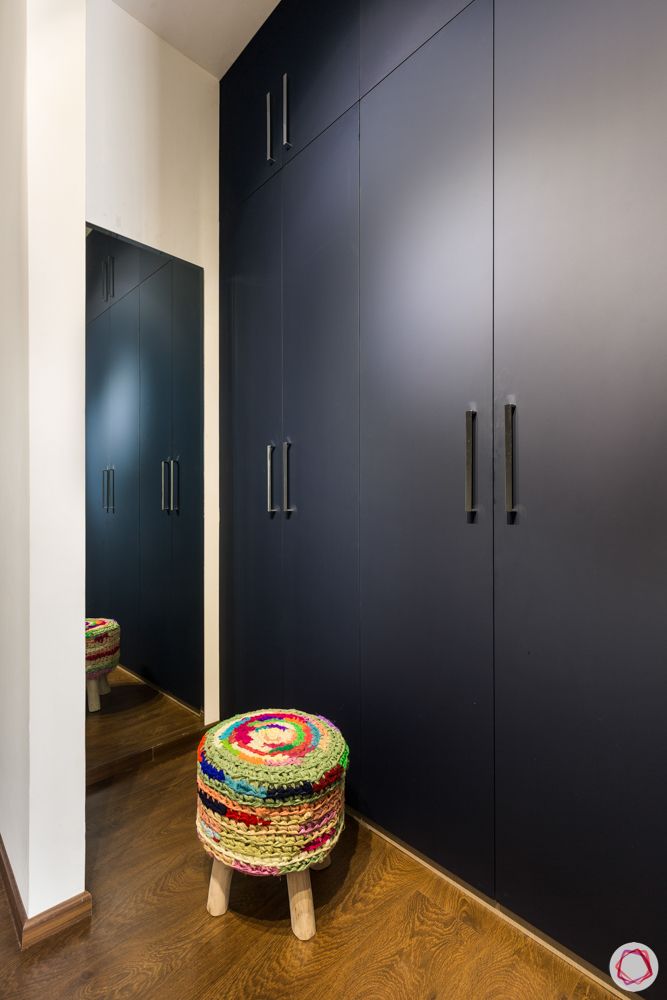 4 bhk apartment-colourful pouffe-dark blue wardrobe designs