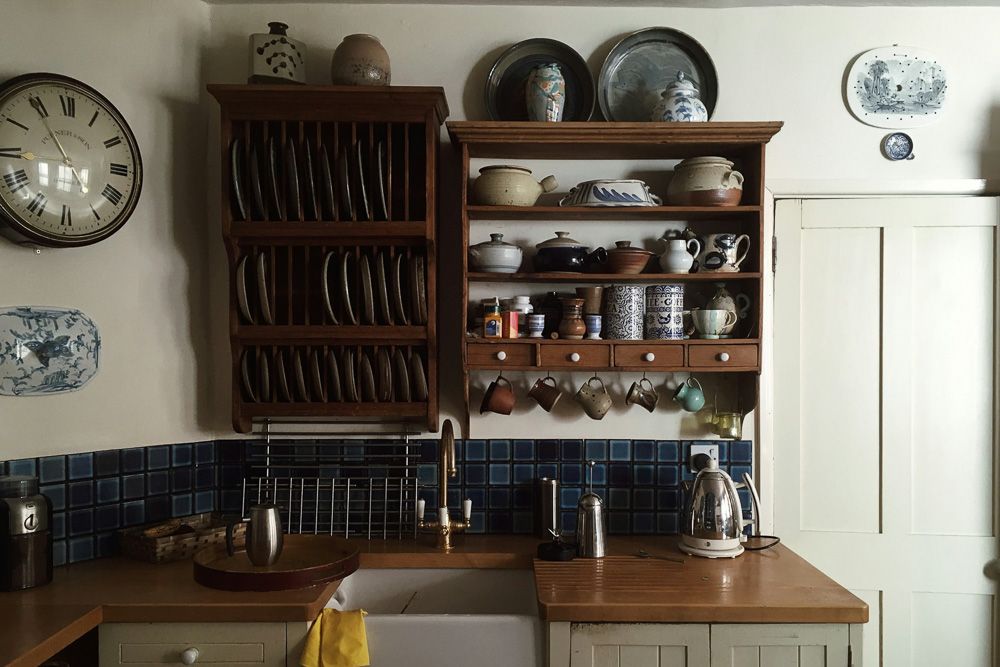 modern open shelving kitchen on top of the sink