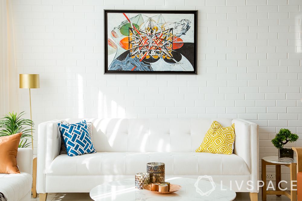 maintain-light-color-sofas-white-sofa-abstract-wall-painting-white-brick-wall
