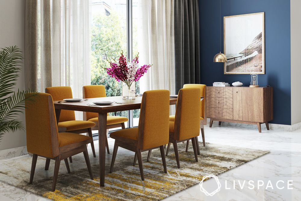 dining-room-decoration-with-blue-painted-accent-wall-yellow-chairs-wood-furniture-rug