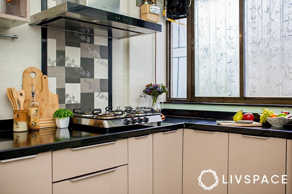 black-granite-countertops-in-beige-kitchen