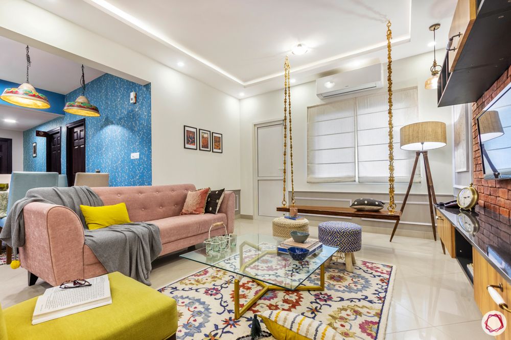 sobha-aspire-living-room-swing-glass-centre-table-pink-sofa