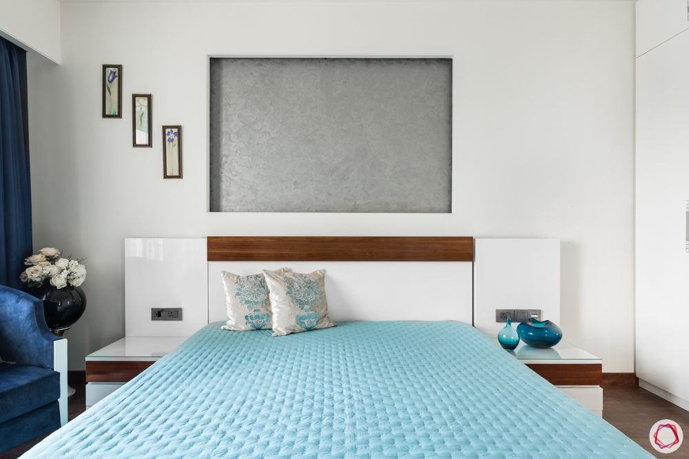 DLF Capital Greens-bedroom-blue-wall-niche-bedsheet