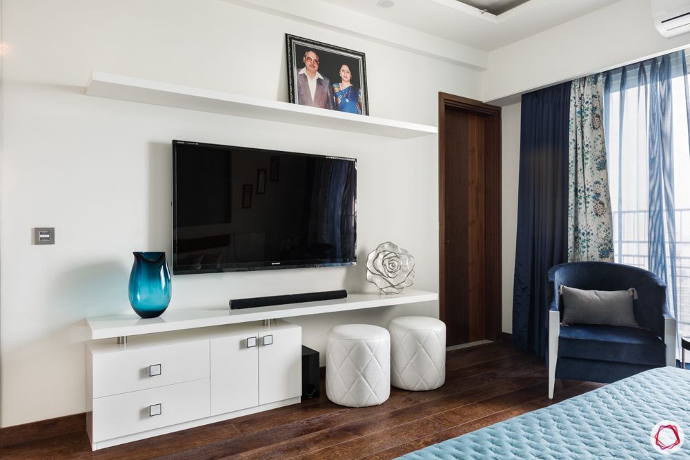 DLF Capital Greens-bedroom-blue-TV-unit-shelves