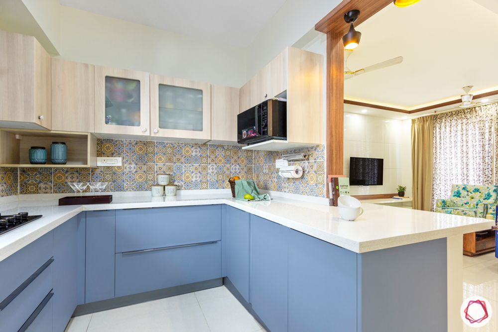 kitchen-tile backsplash-blue cabinets-breakfast counter
