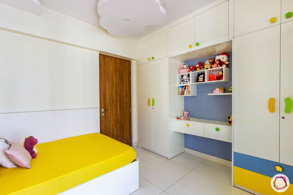 kids bedroom-white wardrobe-yellow bed-colourful handles