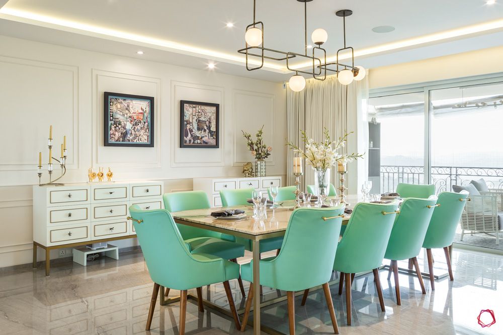livspace home interiors-green dining chairs-marble table top designs