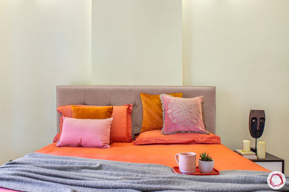 Salarpuria-Sattva-Aspire-hometour-bed-orange-sheet-pillow