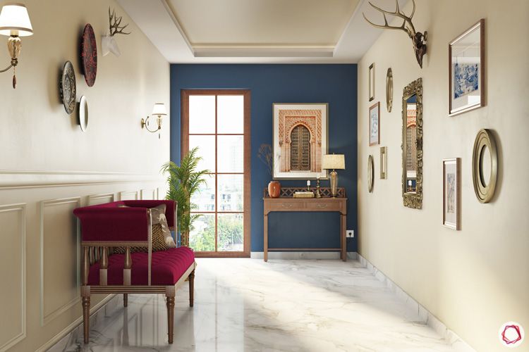 irrfan khan-foyer-blue accent wall-wall art-wooden furniture