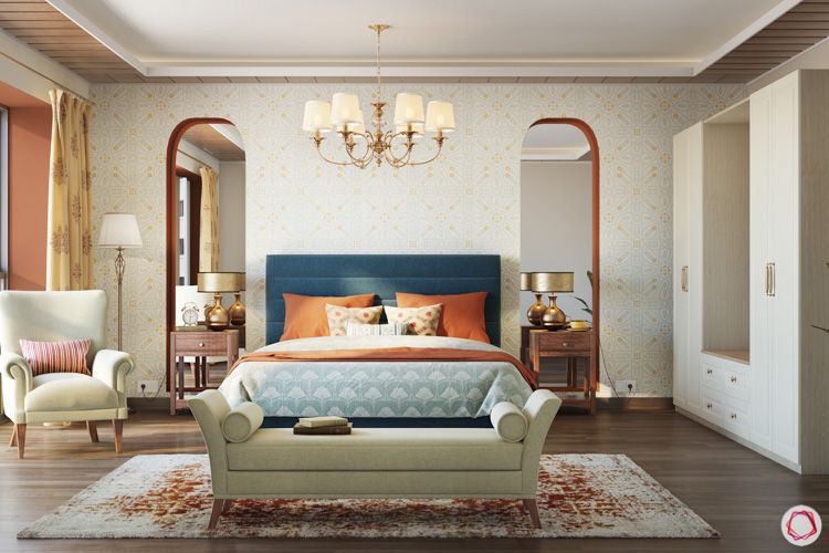 irrfan khan-chandelier-bedroom-blue headboard-armchair-floor lamp