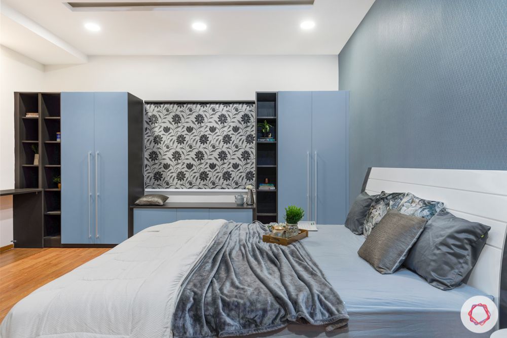 top interior designers in hyderabad-master bedroom-white bed-blue wardrobes-grey wallpaper