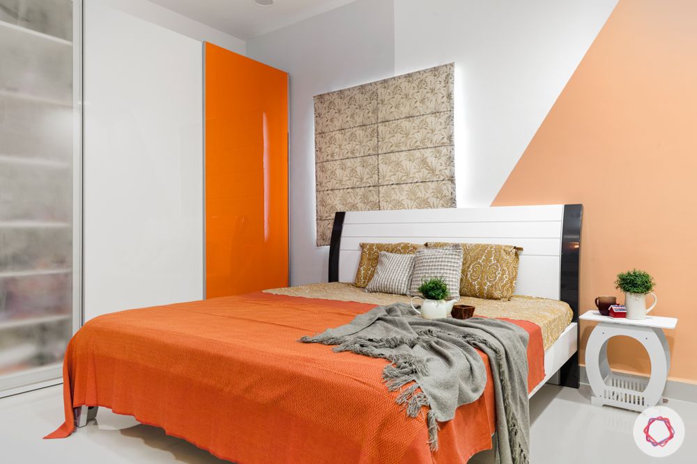 top interior designers in hyderabad-kids bedroom-white bed-orange acrylic wardrobes-orange wall paint