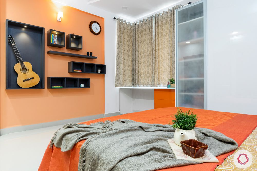 top interior designers in hyderabad-kids bedroom-white bed-orange acrylic wardrobes-orange wall paint