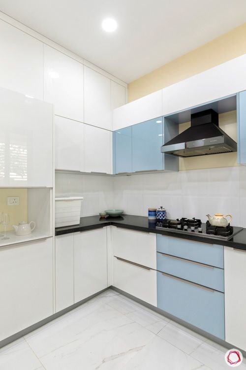 interior design in hyderabad-kitchen-tall unit-chimney-acrylic finish-granite countertop