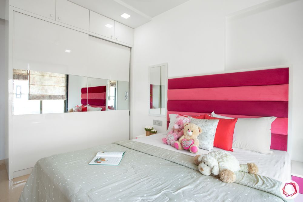 low budget home design-pink cushioned headboard-sliding wardrobes-kids bedroom design