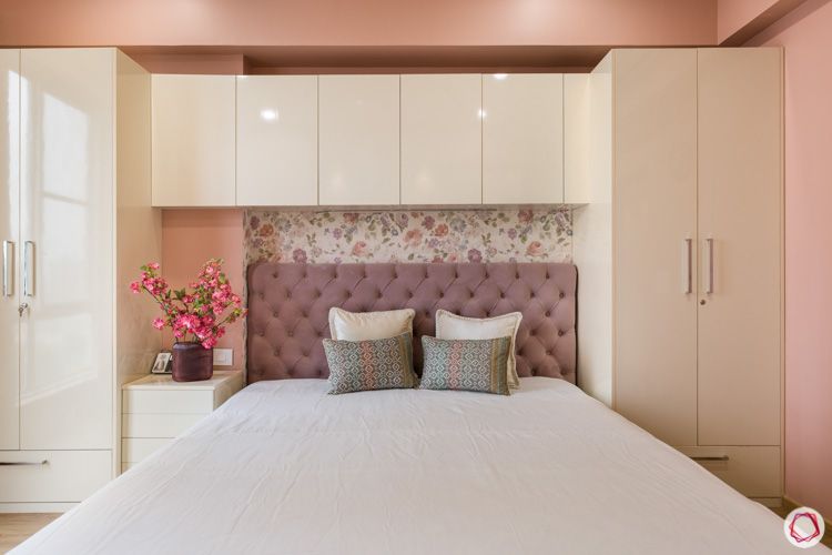 pink cushioned headboard--swing door wardrobe-floral wallpaper designs-false ceiling-spot lights