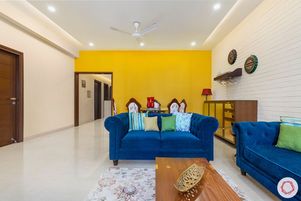 3-bhk-interior-design-yellow-accent-wall-refurbished-furniture-minimal-bar-unit