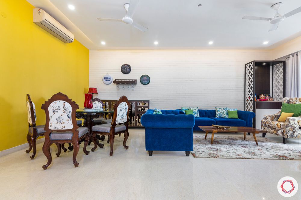 3 bhk interior design-yellow accent wall-refurbished furniture-minimal bar unit-crockery unit