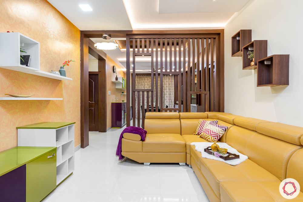 madhavaram serenity-living room-yellow sofa set-wooden partition-green and purple cabinets