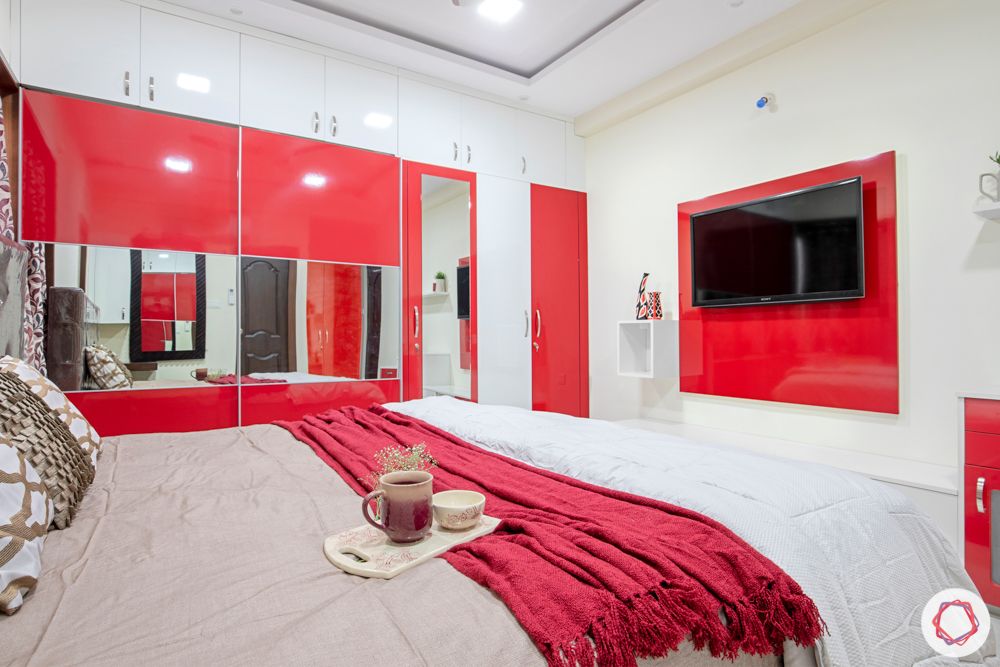 madhavaram serenity-Master Bedroom-red and white wardrobes-brown bed-sliding wardorbe
