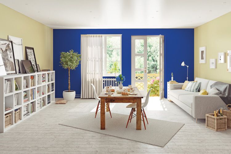 wall colour combination for living room-blue wall-white sofa-bookshelf-dining table