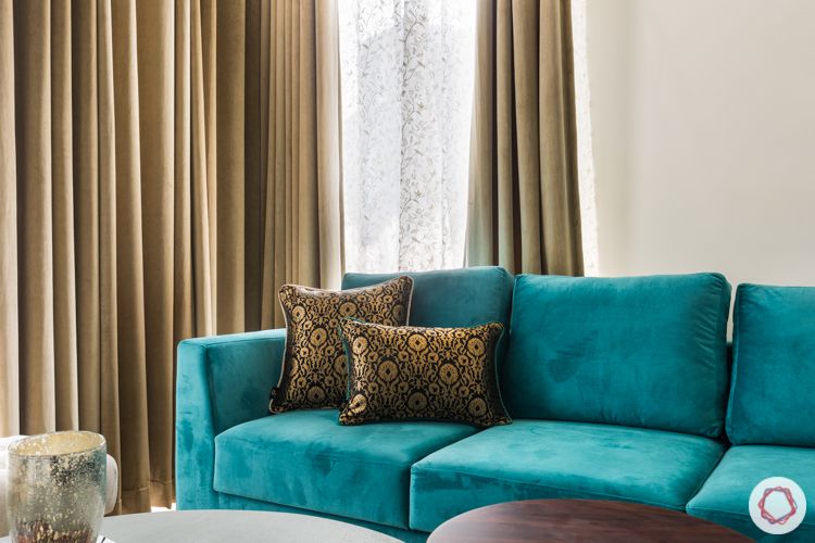 ace-golfshire-noida-interiors-blue-sofa-throwpillows