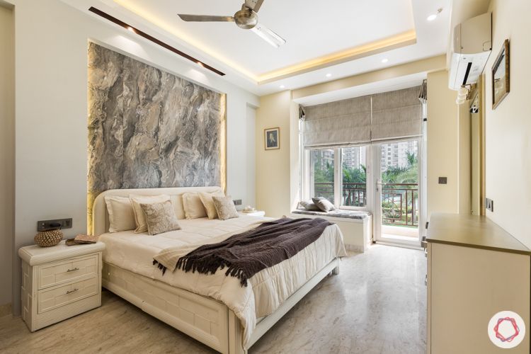 Livspace noida-marble wallpaper-bay seating-gold highlights-dresser