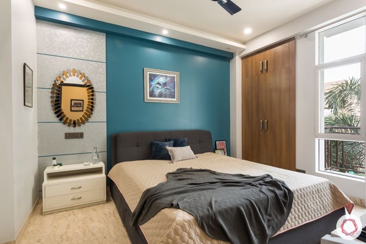 Blue accent wall-silver laminate-wooden dresser