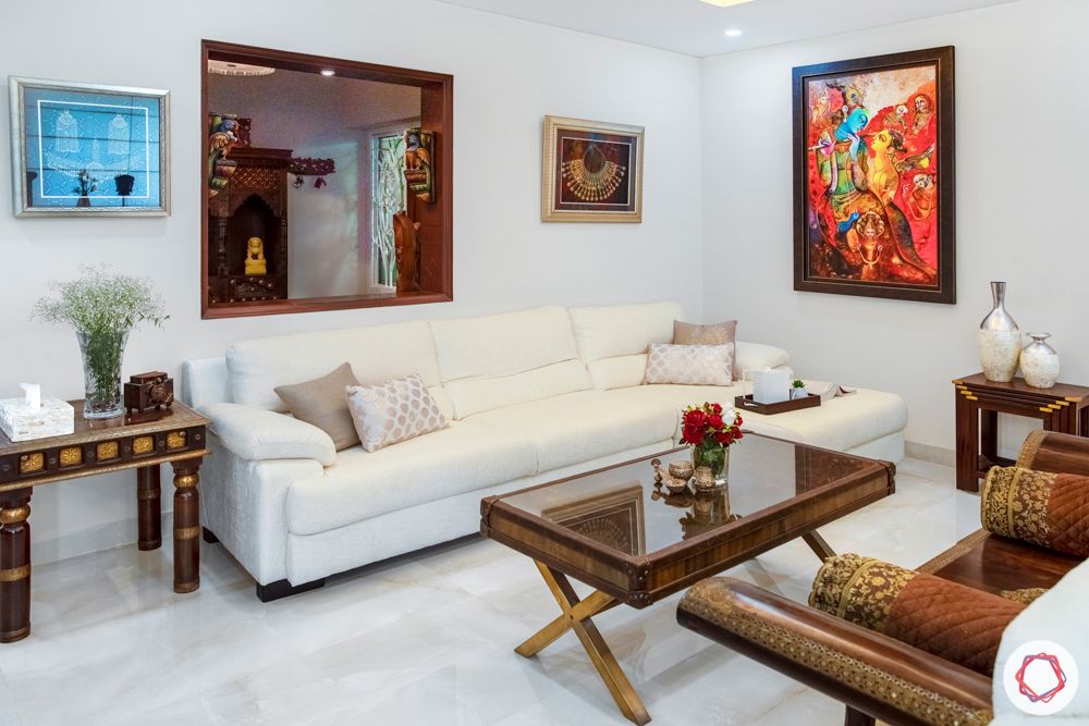 home interiors in chennai-crockery cabinet-swing set-wooden furniture-art work-white sofa