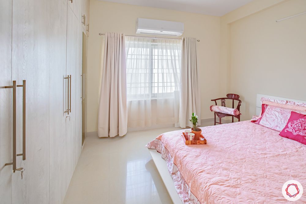 home interiors in chennai-armchair-beige walls-plywood wardrobes