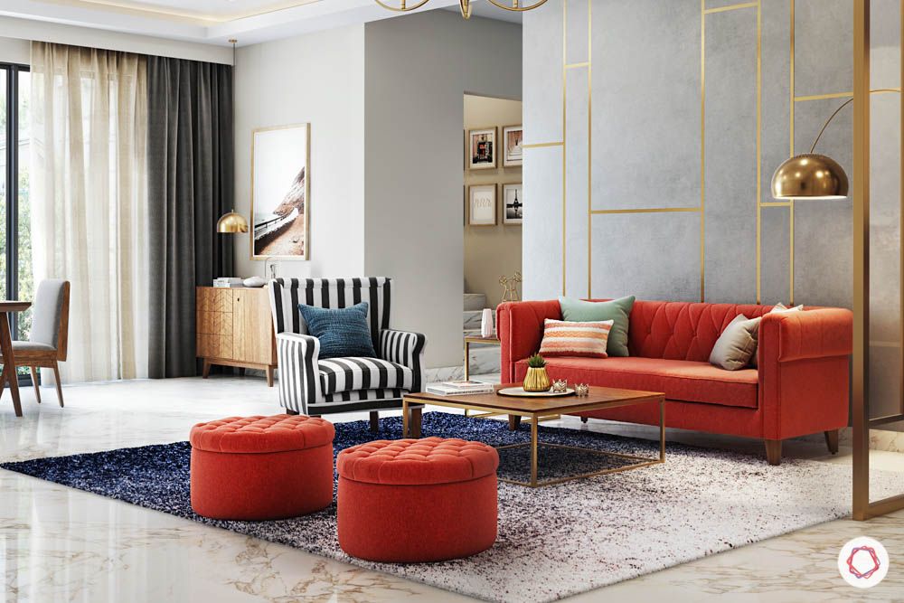 jewel toned interiors-orange sofa-partition designs-chandelier-entryway mirror