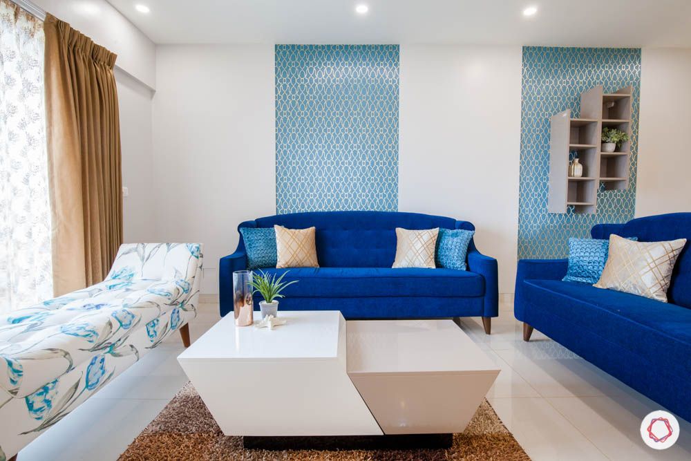 2-bhk-home-design-livspace-pune-living-room-blue-sofa-wallpaper