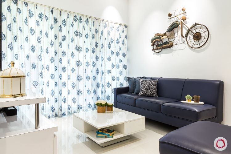 metal fixtures-wall mount-blue curtains-blue sofa
