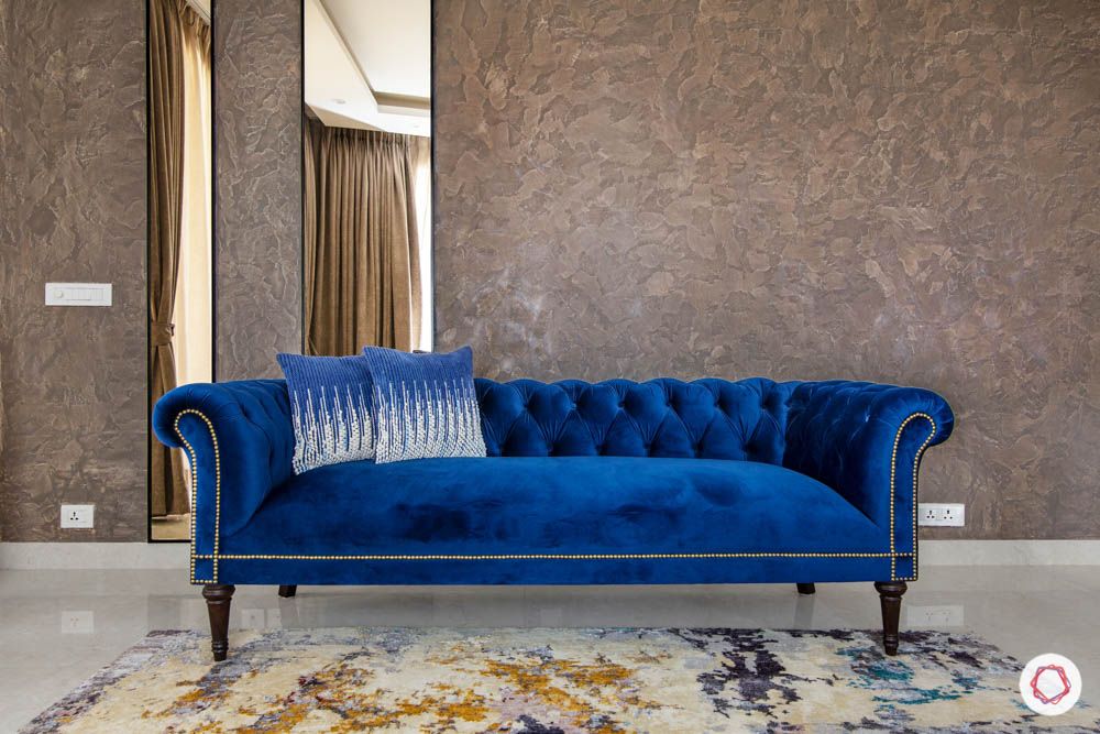 blue sofa-trends 2020- walls-chesterfield-pillows
